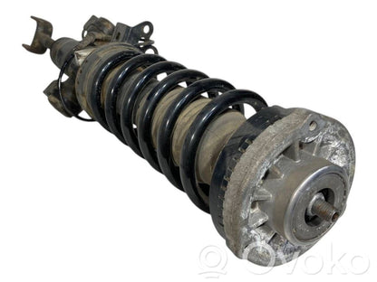 Front shock absorber with spring