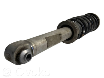 Aizmugurē amortizators ar atsperi