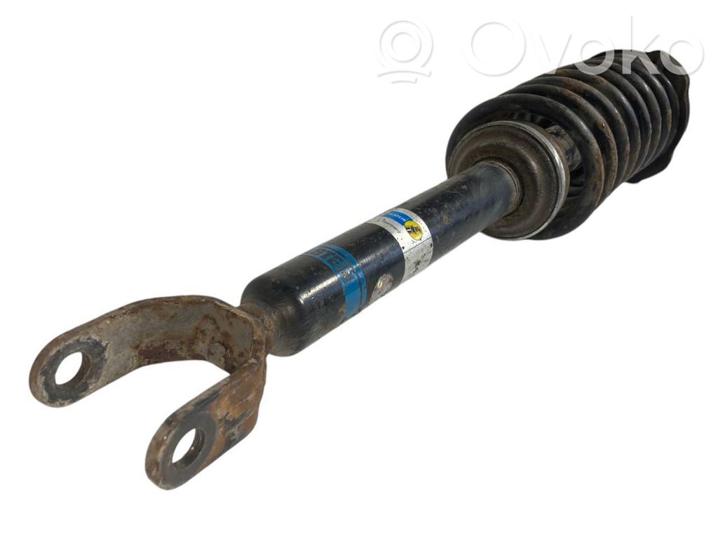 Priekšpusē amortizators ar atsperi