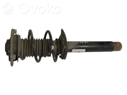 Priekšpusē amortizators ar atsperi