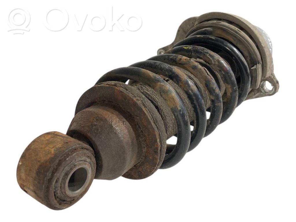 Aizmugurē amortizators ar atsperi