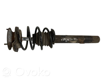 Priekšpusē amortizators ar atsperi