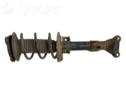 Priekšpusē amortizators ar atsperi