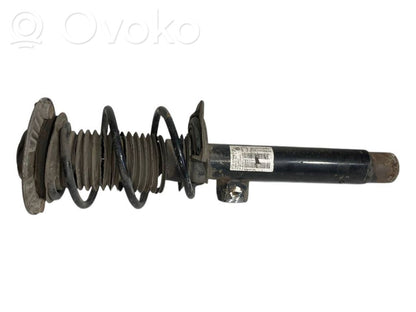 Front shock absorber with spring
