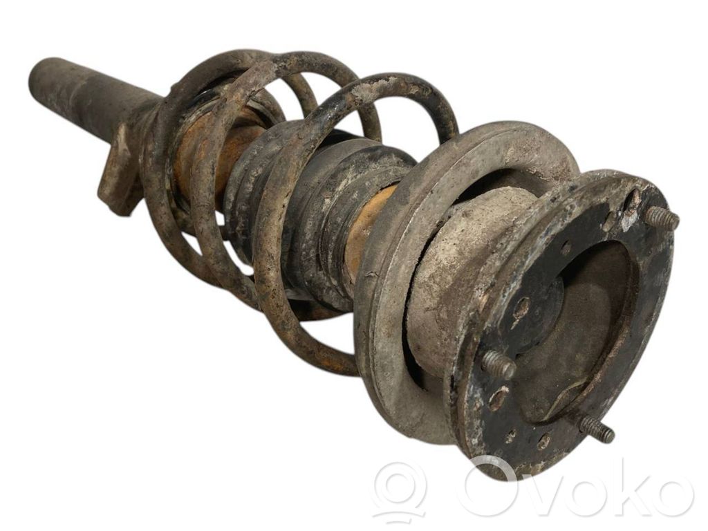 Priekšpusē amortizators ar atsperi