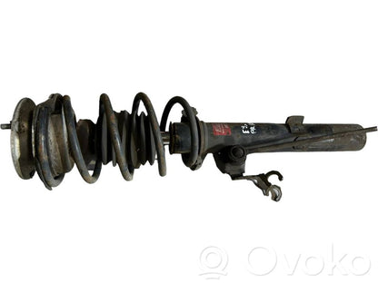 Priekšpusē amortizators ar atsperi