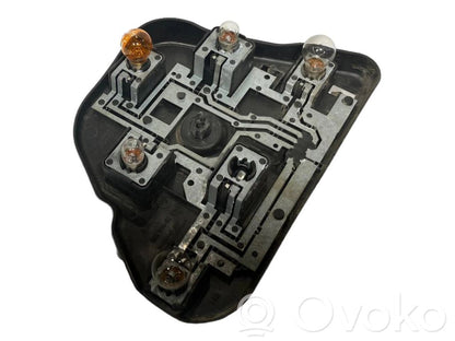 Aizmugures spuldzes vāka turētājs