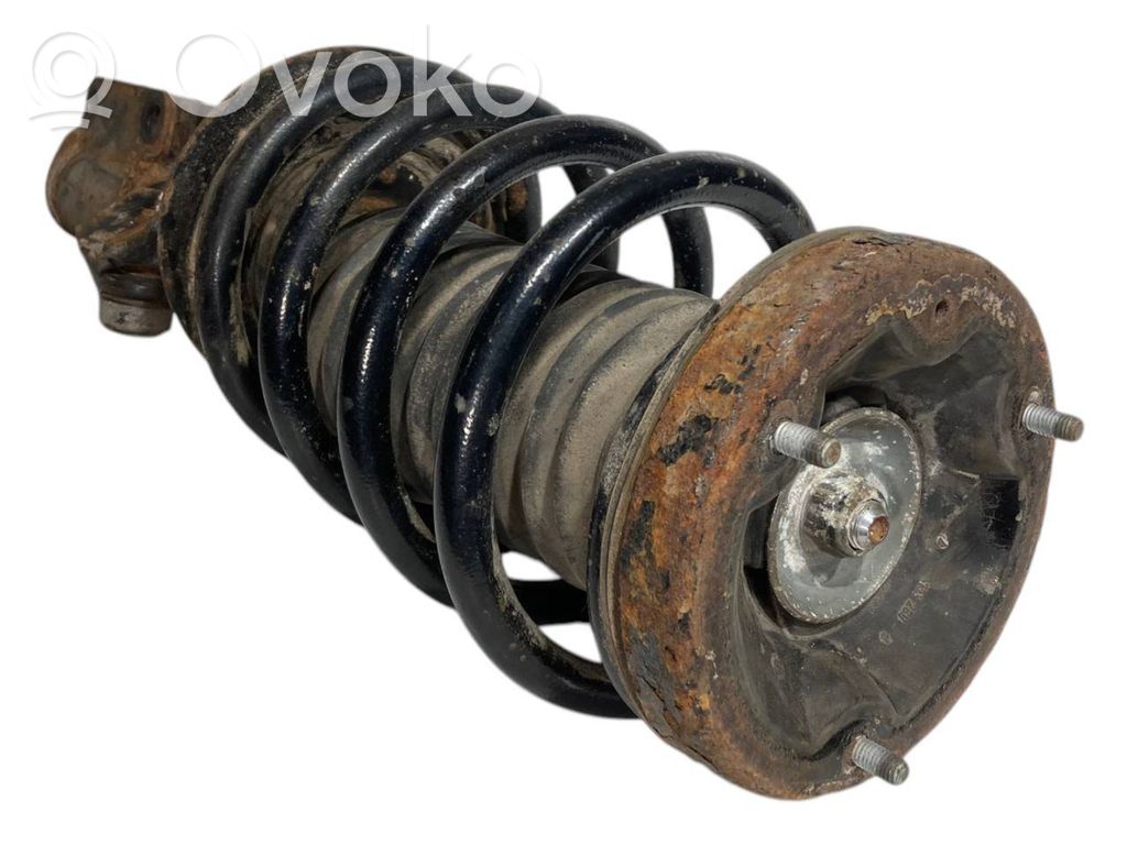 Front shock absorber with spring