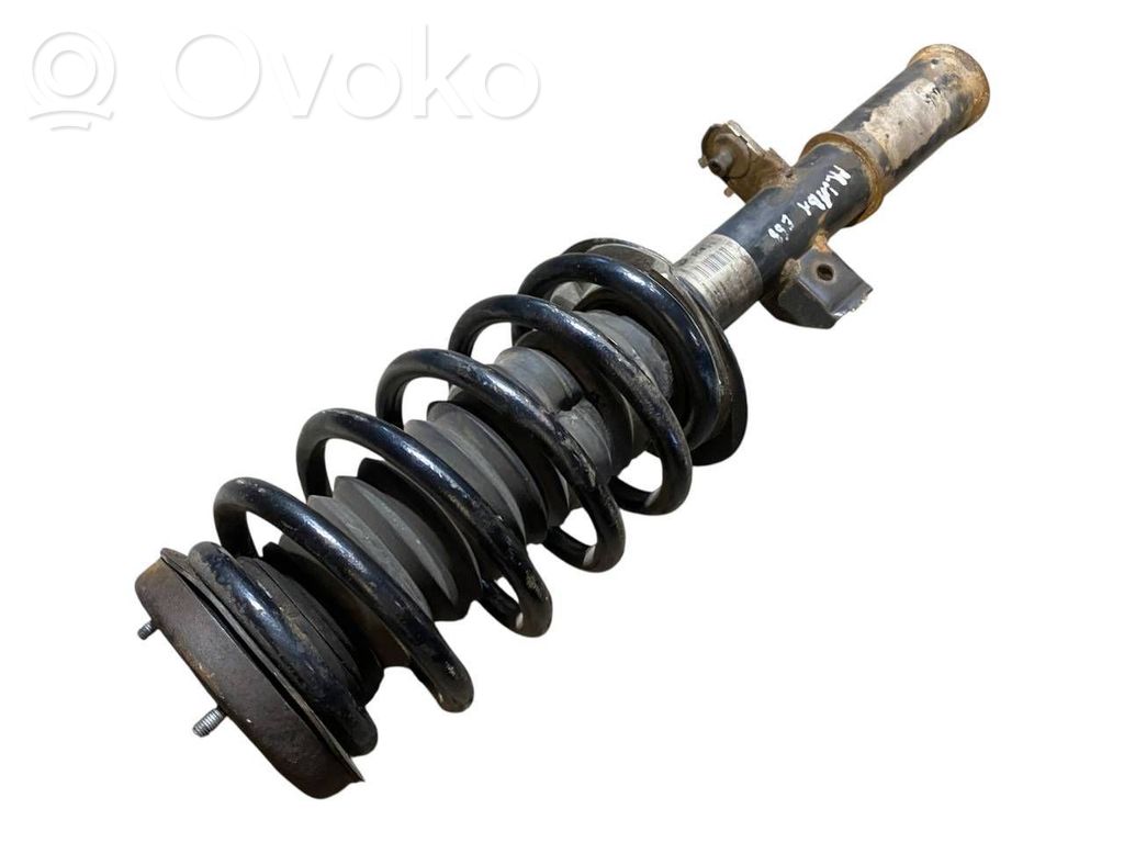 Priekšpusē amortizators ar atsperi