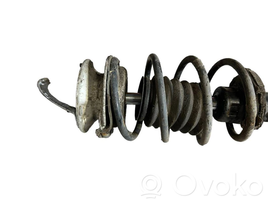 Priekšpusē amortizators ar atsperi