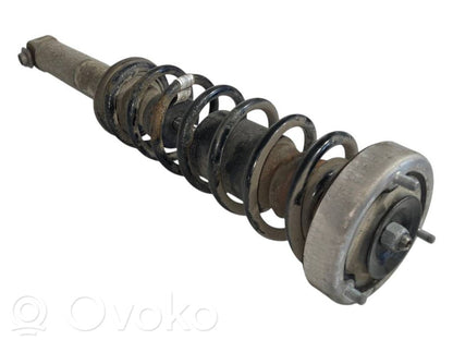 Aizmugurē amortizators ar atsperi