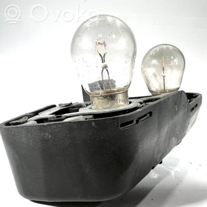 Aizmugures spuldzes vāka turētājs