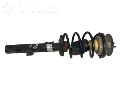 Priekšpusē amortizators ar atsperi