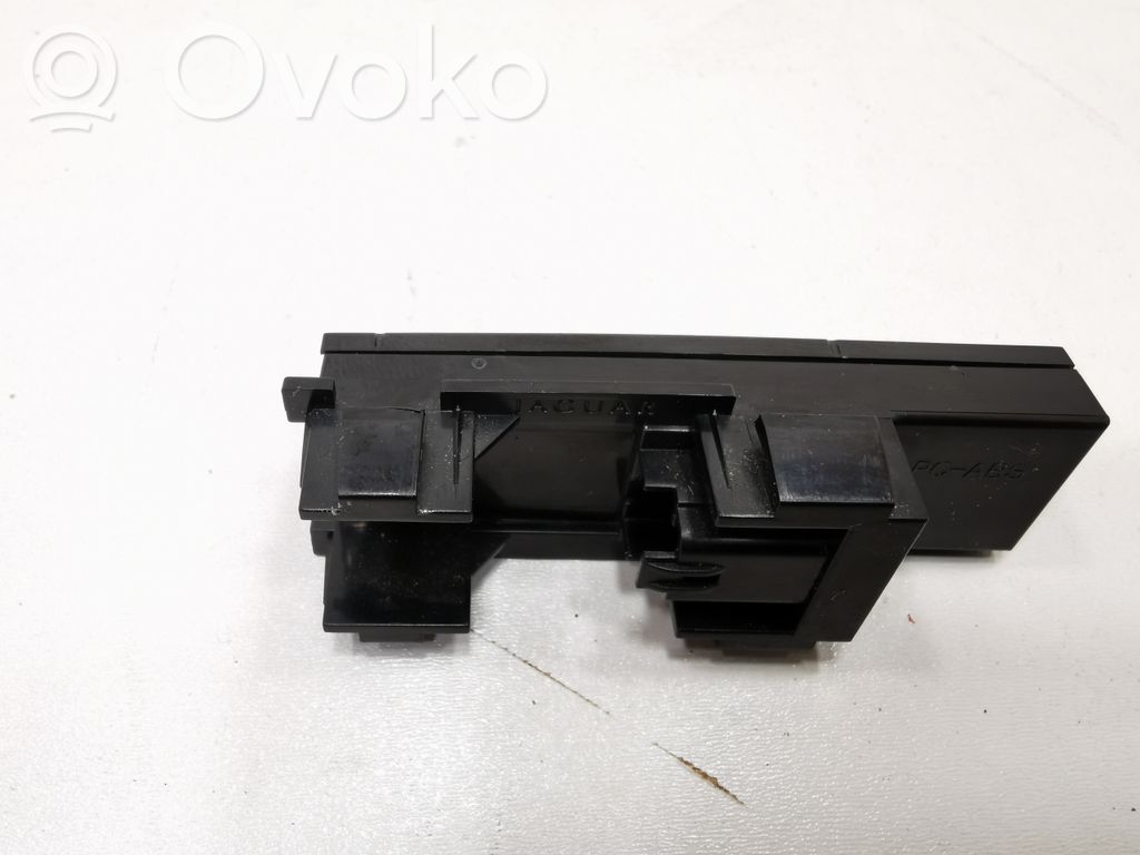 Glove box opening button