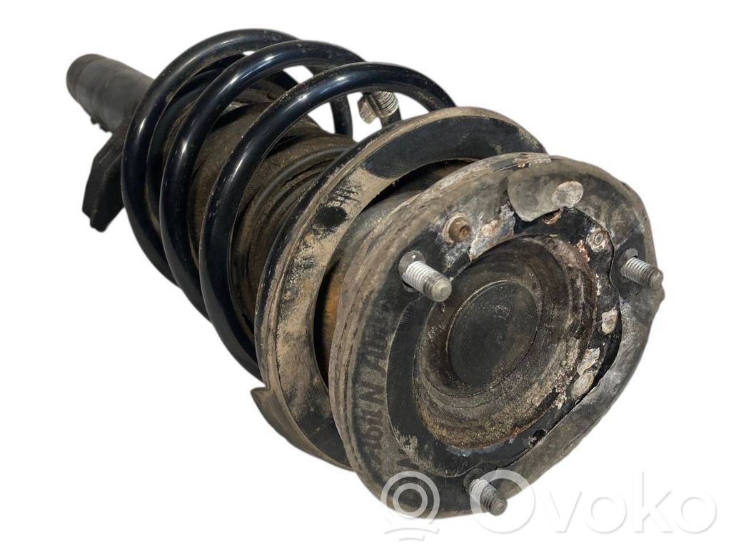 Front shock absorber with spring