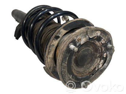 Front shock absorber with spring