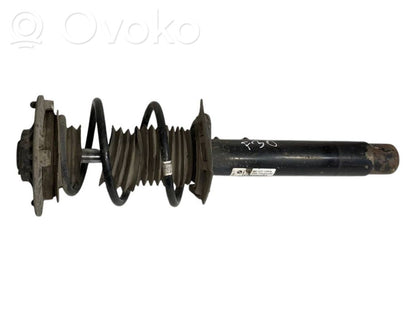 Front shock absorber with spring
