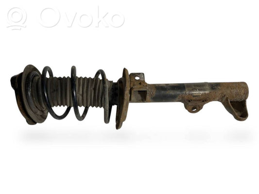 Priekšpusē amortizators ar atsperi