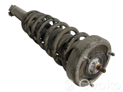 Aizmugurē amortizators ar atsperi