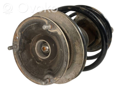 Priekšpusē amortizators ar atsperi