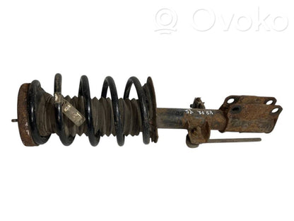 Front shock absorber with spring