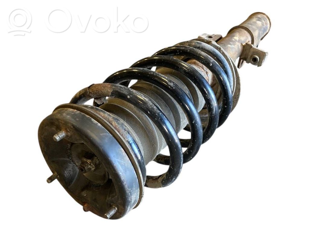 Priekšpusē amortizators ar atsperi