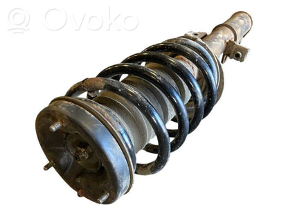 Priekšpusē amortizators ar atsperi