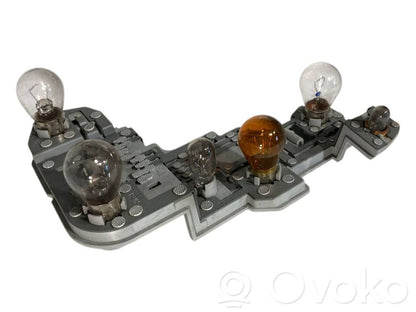 Aizmugures spuldzes vāka turētājs