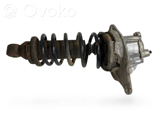 Aizmugurē amortizators ar atsperi