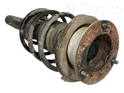 Priekšpusē amortizators ar atsperi