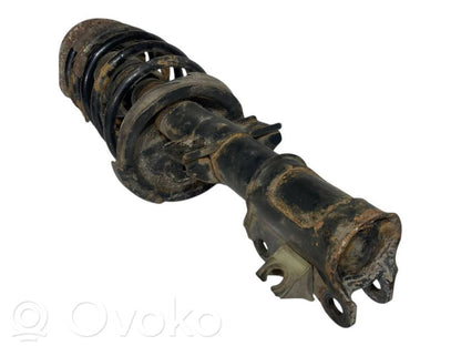 Priekšpusē amortizators ar atsperi