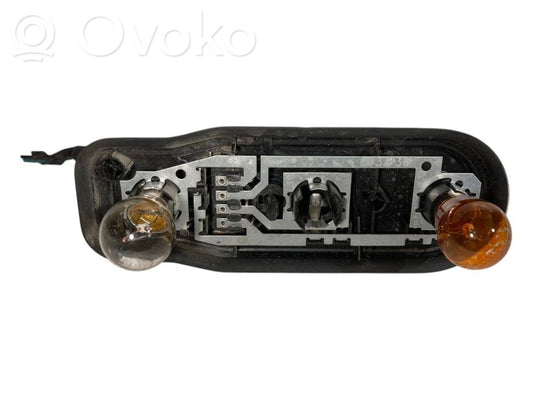 Aizmugures spuldzes vāka turētājs