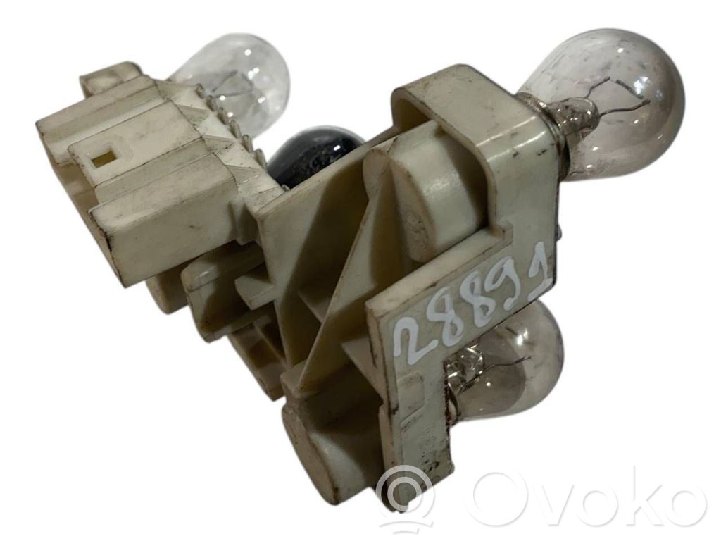 Aizmugures spuldzes vāka turētājs