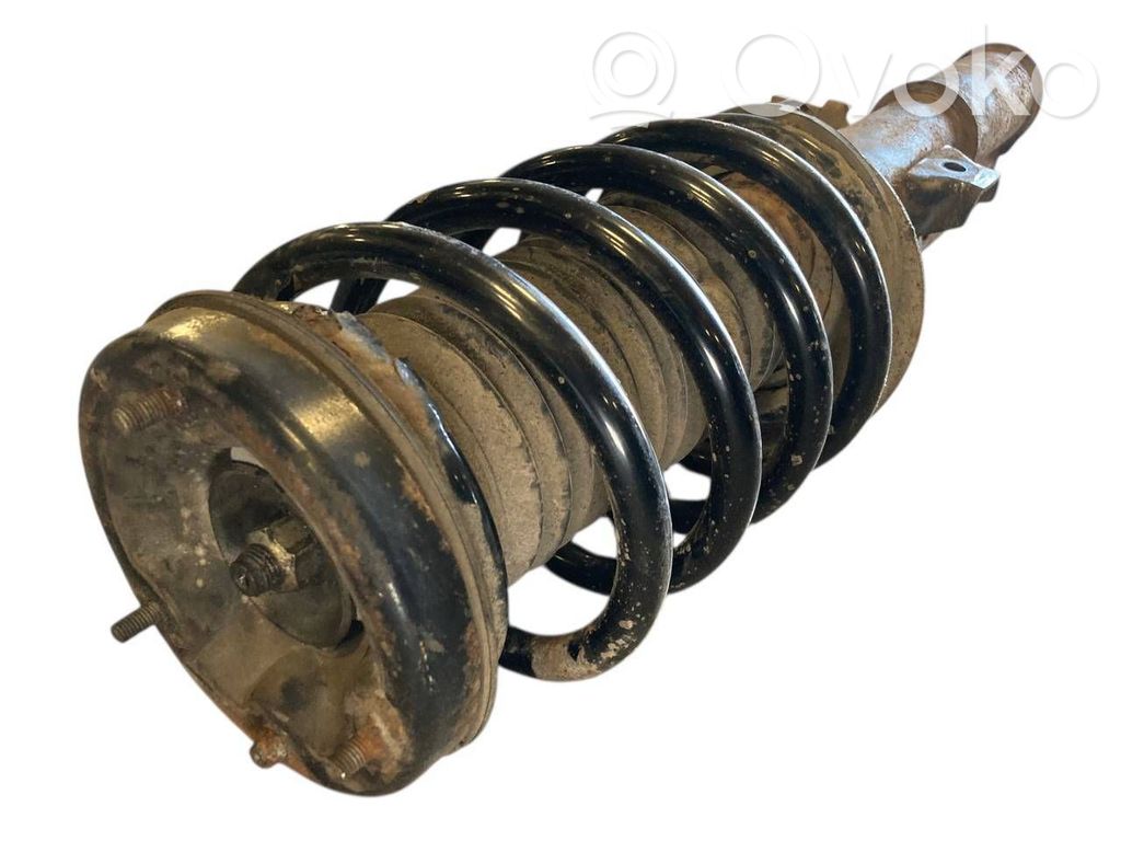 Priekšpusē amortizators ar atsperi