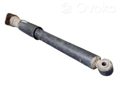 Aizmugurē amortizators ar atsperi