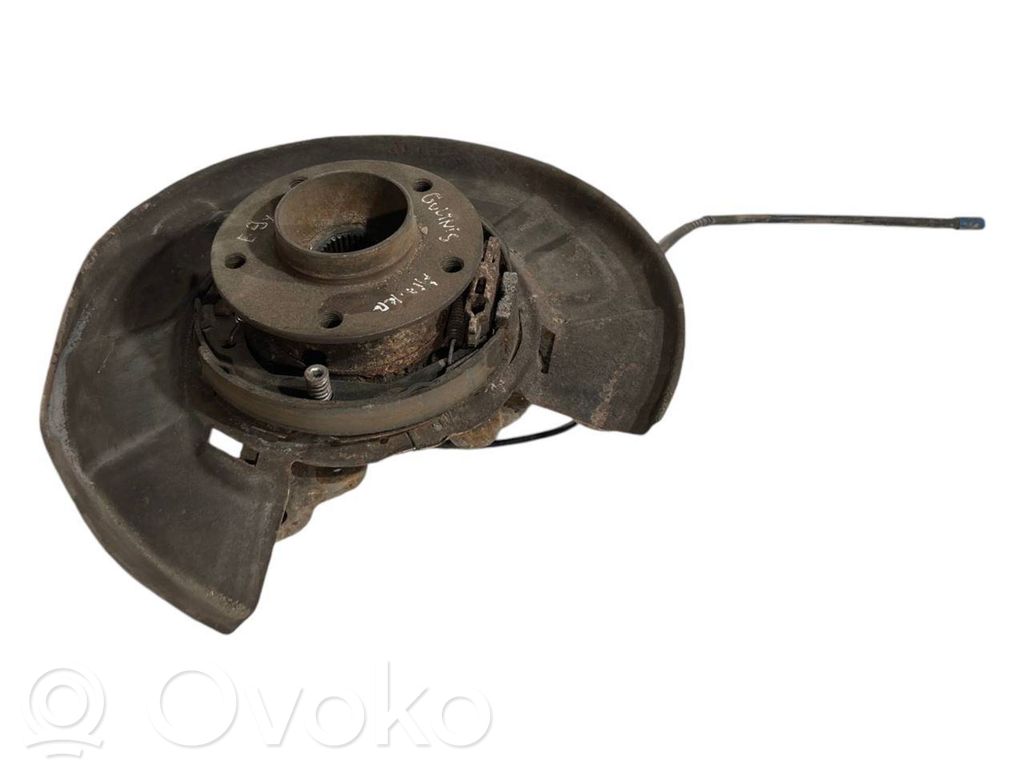 Aizmugurē riteņa rumbas vārpstas šarnīrs (stupica, capfa)